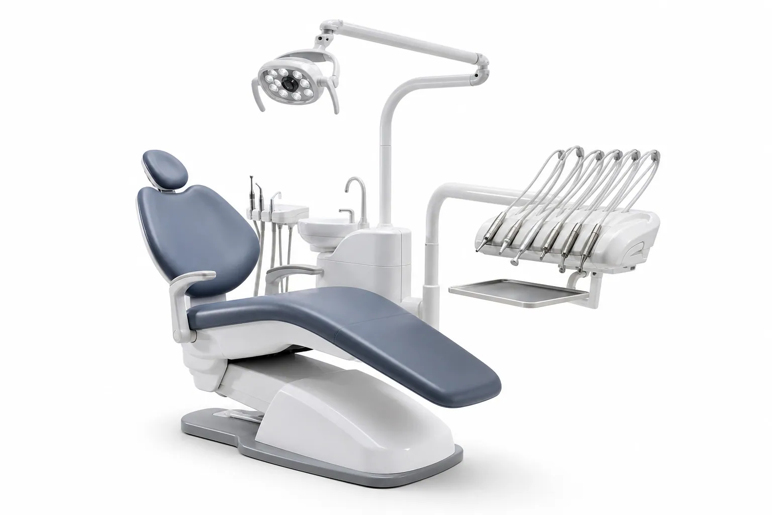 Modern dental treatment unit with chair, overhead light and instrument console